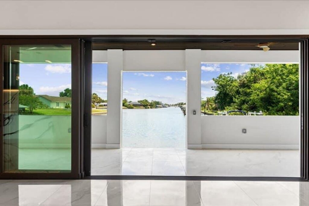Large sliding glass doors and tile floor in a new custom home in Palm Coast