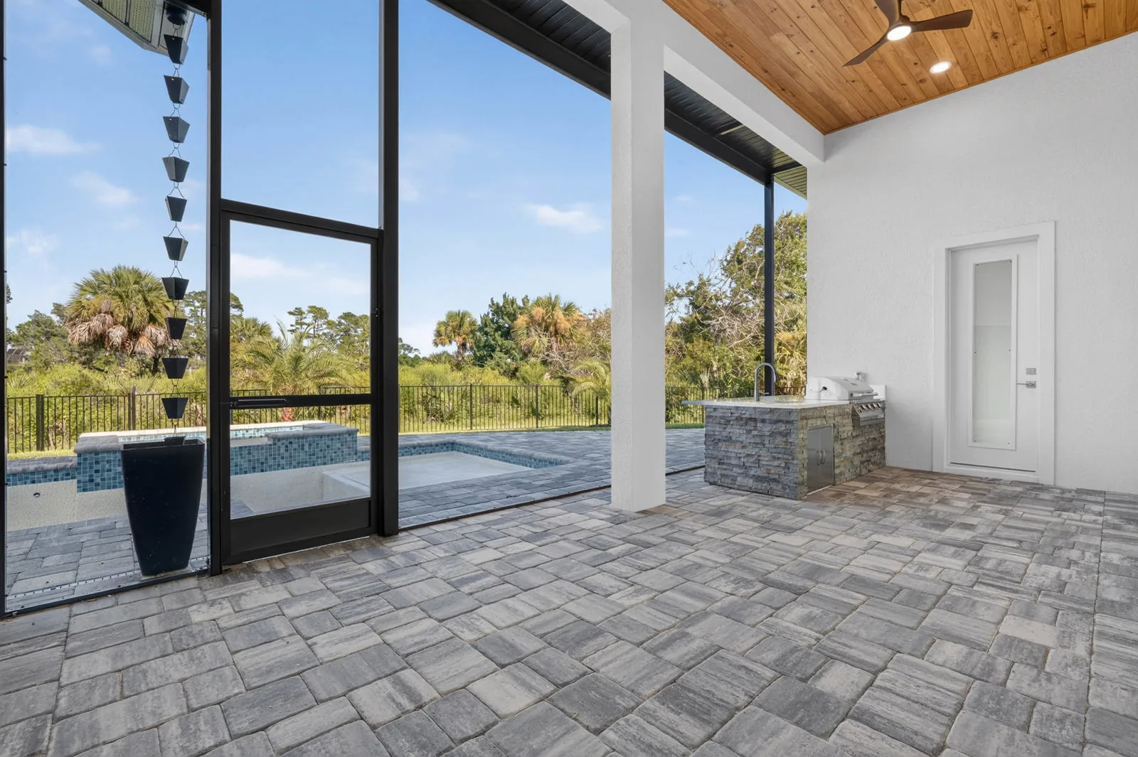 The Anna Marie model by Wise Choice Custom Homes, covered outdoor kitchen with mahogany ceiling